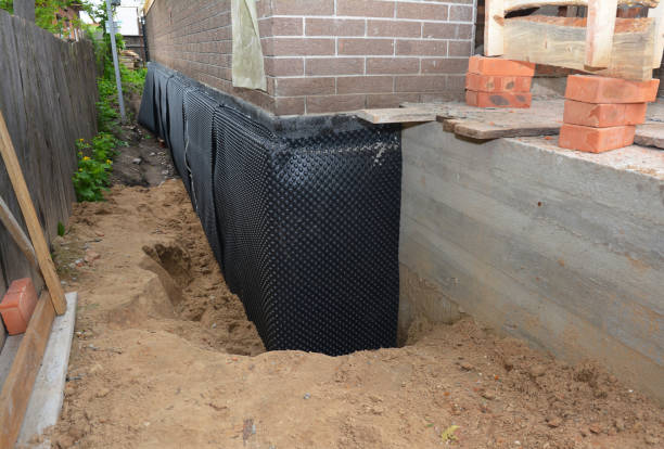 Happy homeowners after waterproofing job in Goldvein